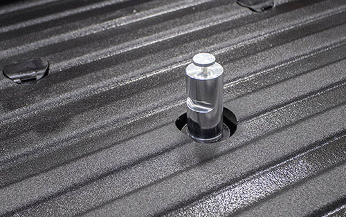 The Andersen Bed Shaft sitting simply in the back of a pickup truck bed.
