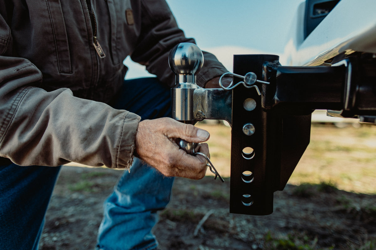 Closeup of a man installing an Andersen Hitches Rapid Hitch