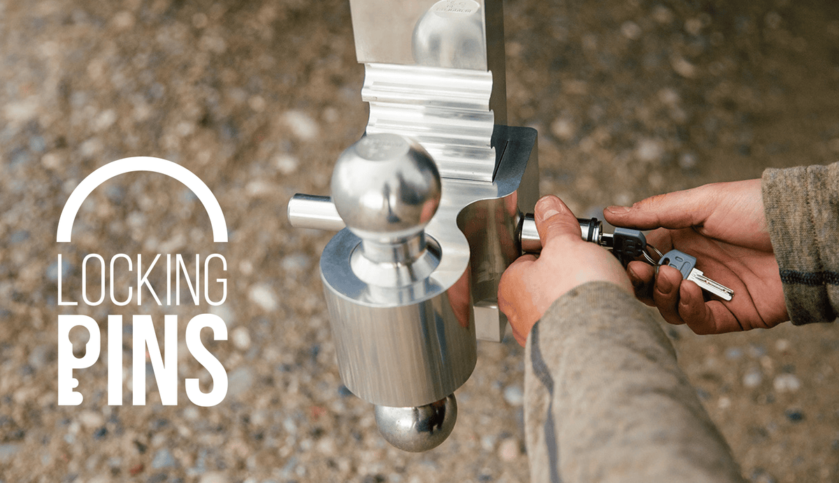 Andersen Hitches Locking Pin Being locked by hands outside.