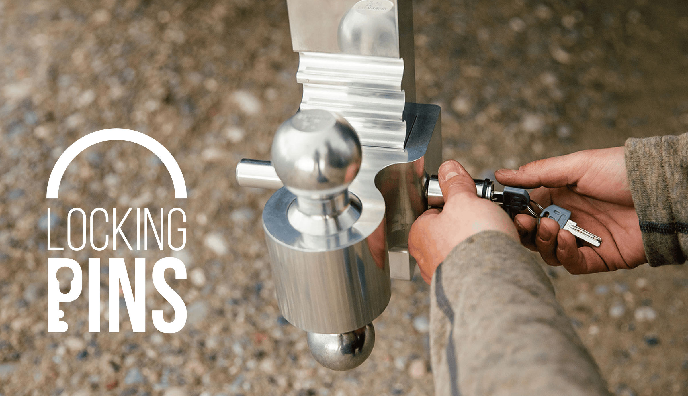 Andersen Hitches Locking Pin Being locked by hands outside.