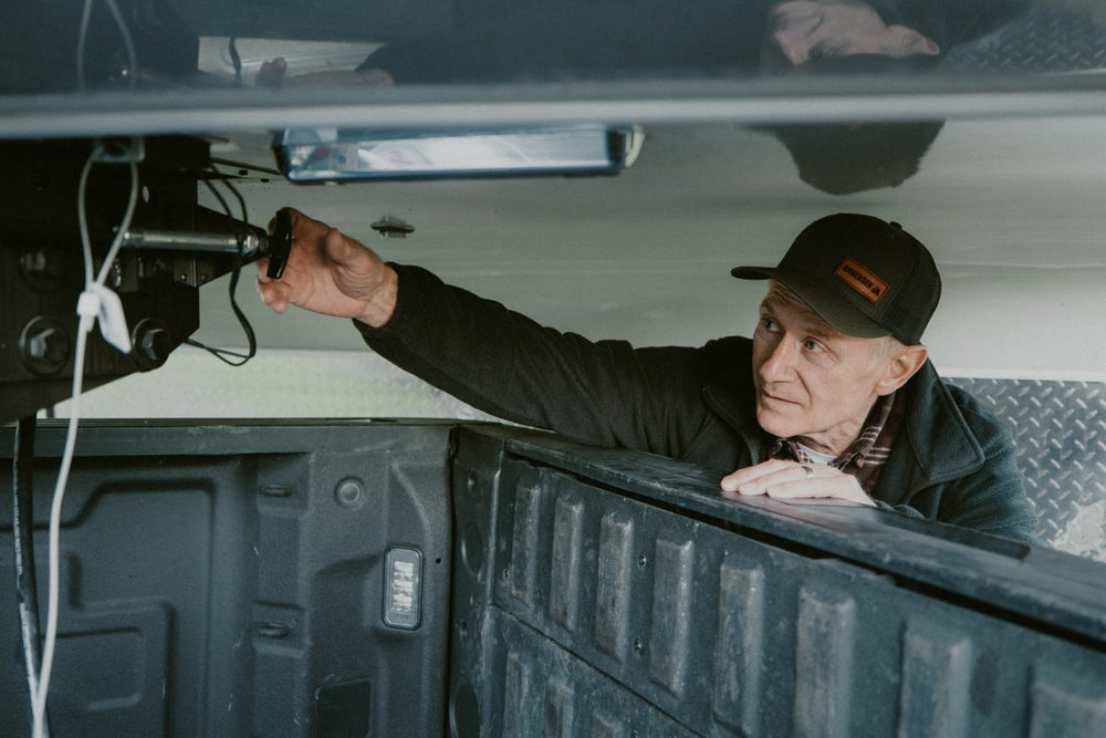 Man Working on his Andersen Hitches 5th Wheel hitch.