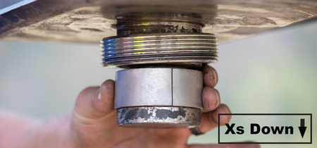 RANCH_HITCH_ADAPTER_COLLAR_SYSTEM getting put on a trailer to be installed.