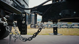 A closeup of an Andersen Hitches Weight Distribution Hitch towing a trailer.