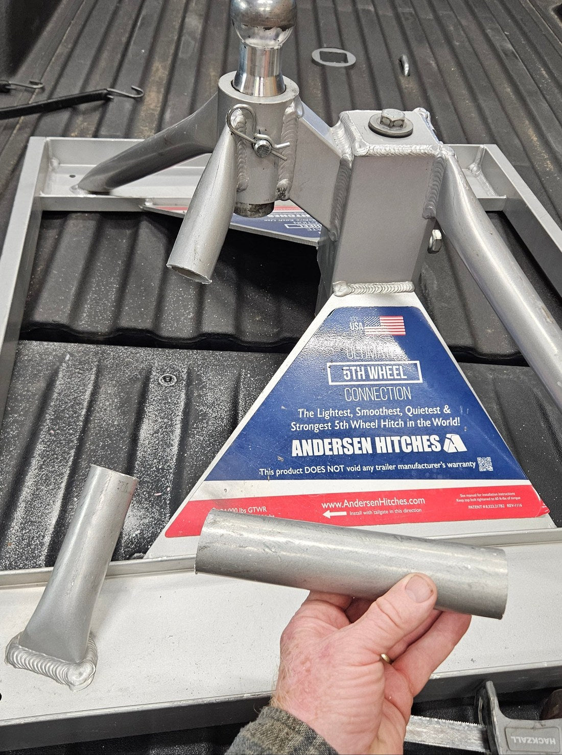 Example of an older Ultimate Connection base with one round-tube leg cut and the removed section held beside it